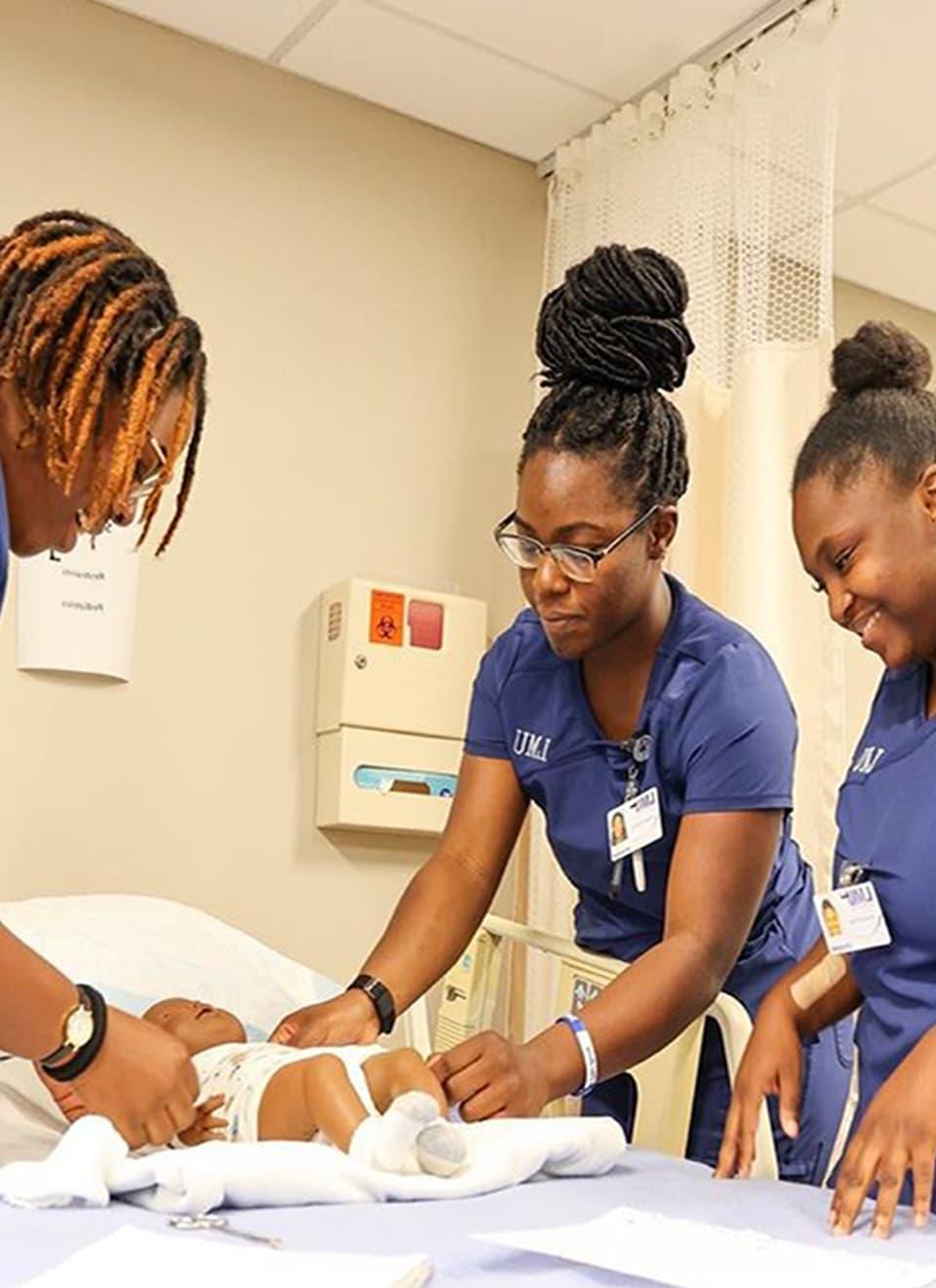 students taking care of baby